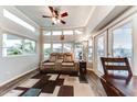 Bright living room with large windows and comfortable seating at 17200 W Bell Rd # 196, Surprise, AZ 85374