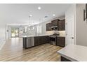 Modern kitchen with stainless steel appliances and an island at 17440 W Eugene Ter, Surprise, AZ 85388