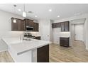 Modern kitchen with stainless steel appliances and an island at 17440 W Eugene Ter, Surprise, AZ 85388