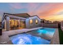 Stunning backyard oasis featuring a sparkling pool and spa at 17440 W Eugene Ter, Surprise, AZ 85388