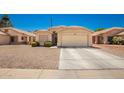 House exterior showcasing a driveway and front yard at 1762 S Saddle St, Gilbert, AZ 85233