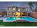 Inviting pool with spacious patio and backyard perfect for entertaining at 17673 W Agave Rd, Goodyear, AZ 85338