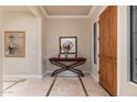 Bright and spacious entryway with tile flooring and a console table at 17918 N 95Th St, Scottsdale, AZ 85255