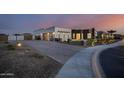 Modern home exterior, featuring a combination of stucco and stone at 23311 N 95Th Dr, Peoria, AZ 85383
