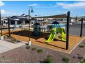 Community playground with modern equipment and shaded areas at 3418 E Audrey Dr, San Tan Valley, AZ 85143