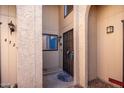 Condo entrance with a brown door and columns at 4731 W Continental Dr, Glendale, AZ 85308