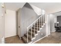 Staircase with gray walls and carpeted steps at 4731 W Continental Dr, Glendale, AZ 85308