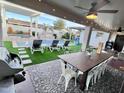 Large backyard with pool, spa, dining area, and games at 8114 E Clarendon Ave, Scottsdale, AZ 85251