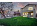 Large backyard with grassy area and covered patio at 10760 W Monte Vista Rd, Avondale, AZ 85392
