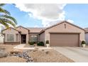 Single-story home with desert landscaping and two-car garage at 15253 W Pasadena Dr, Surprise, AZ 85374