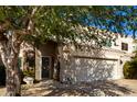 Front view of a two-story home with an attached garage at 16450 E Ave Of The Fountains -- # 23, Fountain Hills, AZ 85268