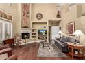 Spacious living room with hardwood floors, fireplace, and high ceilings at 16450 E Ave Of The Fountains -- # 23, Fountain Hills, AZ 85268