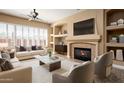 Spacious living room with a fireplace and built-in shelving at 1807 W Sierra Sunset Trl, Phoenix, AZ 85085