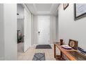 Entryway with tile floors and a console table at 18254 W Via Montoya Dr, Surprise, AZ 85387