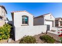 White stucco home with a gated side yard at 18254 W Via Montoya Dr, Surprise, AZ 85387