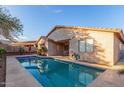Inviting backyard pool with patio and view of the house at 18645 W Mcneil St, Goodyear, AZ 85338