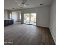 Bright living room featuring tile floors and access to backyard at 22254 W Skinner Rd, Wittmann, AZ 85361
