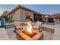Cozy up by the fire pit on cool evenings at 41717 N Harbour Town Way, Anthem, AZ 85086
