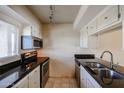 Condo kitchen with stainless steel appliances and granite counters at 7436 E Chaparral Rd # B260, Scottsdale, AZ 85250