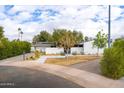 Mid-century home with a nicely landscaped front yard and street view at 8521 N 15Th Dr, Phoenix, AZ 85021