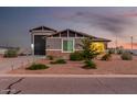 Two-story house with a large garage and landscaped yard at 10447 W Appaloosa Trl, Casa Grande, AZ 85194