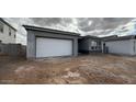 Charming single-story home with gray stucco and a white garage door at 11441 E Utah Ave, Mesa, AZ 85212