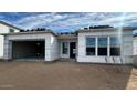 New home's exterior showcasing the garage and roof under construction at 11441 E Utah Ave, Mesa, AZ 85212