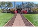 Brick pathway leading to a charming home entrance at 17045 N 58Th Way, Scottsdale, AZ 85254