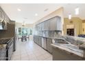 Spacious kitchen with granite countertops and stainless steel appliances at 18205 N Divet Ln, Surprise, AZ 85374