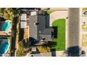 An aerial view showcasing the house, pool, and backyard at 1825 W Seldon Way, Phoenix, AZ 85021