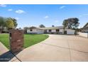 House exterior showcasing a well-maintained lawn and driveway at 1825 W Seldon Way, Phoenix, AZ 85021