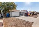 Single-story home with attached garage and driveway at 18825 N 34Th St, Phoenix, AZ 85050