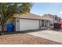 Single-story home with attached garage and desert landscaping at 18825 N 34Th St, Phoenix, AZ 85050