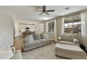 Open concept living room with a view into the kitchen area at 20409 E Escalante Ct, Queen Creek, AZ 85142