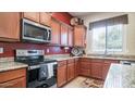 Granite countertops and stainless steel appliances in this kitchen at 2147 S Valle Verde Cir, Mesa, AZ 85209