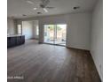 Spacious living area with sliding glass doors leading to the backyard at 22216 W Skinner Rd, Wittmann, AZ 85361