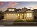 Two-story home with a neutral color palette and a landscaped yard at 22897 E Carriage Way, Queen Creek, AZ 85142