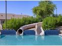 Community pool with waterslide and multiple decks at 335 S San Fernando Ln, Casa Grande, AZ 85194