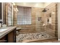 Beautiful walk-in shower with pebble floor and rain head at 3559 E Bridgeport Pkwy, Gilbert, AZ 85295