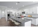 Bright, modern kitchen with a large island, stainless steel appliances, and white cabinets at 4120 E Ghost Flower Ln, San Tan Valley, AZ 85140