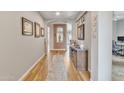 Bright hallway with wood flooring and artwork at 4229 E Seasons Cir, Gilbert, AZ 85297