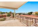 Balcony view overlooking desert landscaping with plants and trees with homes in the distance at 5010 E Mesquite Wood Ct, Phoenix, AZ 85044