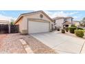 Two-car garage with a long driveway and rock landscaping at 541 W Prickly Pear Dr, Casa Grande, AZ 85122