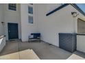 Small front porch with a bench, providing a welcoming entrance to the home at 6073 W Caribe Ln, Glendale, AZ 85306