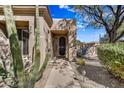 Front entry with security door and pathway at 6970 E Hibiscus Way, Scottsdale, AZ 85266