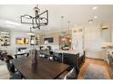 Open concept dining and kitchen area with hardwood floors at 7420 N San Manuel Rd, Scottsdale, AZ 85258