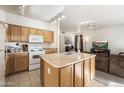 Functional kitchen featuring an island and a view of the living area at 934 S Bristol Dr, Mesa, AZ 85208