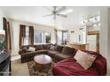 Cozy living room with a large sectional sofa and a view to the backyard at 934 S Bristol Dr, Mesa, AZ 85208