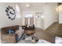 Inviting living room with vaulted ceilings, plush furniture, and plenty of natural light at 934 S Bristol Dr, Mesa, AZ 85208