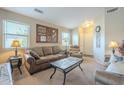 Living room with neutral colored couch and coffee table at 11029 W Mountain View Dr, Avondale, AZ 85323